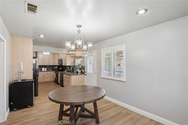 1776 San Bernardino Ave, Pomona, CA 91767 - dining space featuring a chandelier and light wood finished floors