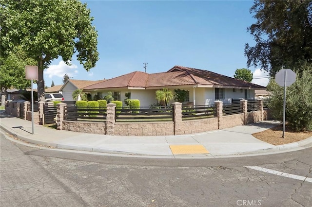 1776 San Bernardino Ave, Pomona, CA 91767 - ranch-style home featuring a fenced front yard, stucco siding, and a tiled roof