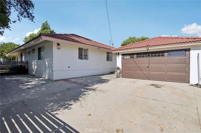 1776 San Bernardino Ave, Pomona, CA 91767 - view of side of property featuring stucco siding and a tiled roof