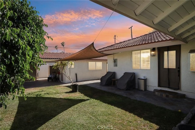 1776 San Bernardino Ave, Pomona, CA 91767 - rear view of house with a tiled roof, stucco siding, and a patio