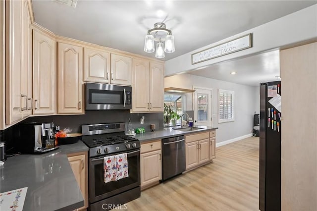 1776 San Bernardino Ave, Pomona, CA 91767 - kitchen with stainless steel appliances, light brown cabinets, and light wood-style flooring