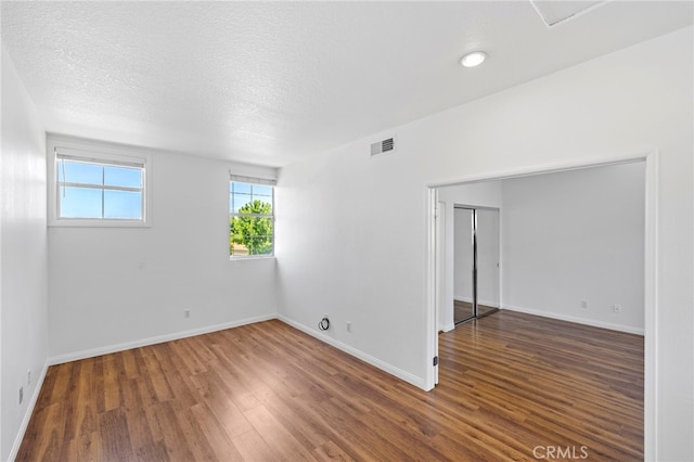 27884 Via De Costa, San Juan Capistrano, CA 92675 - spare room with wood finished floors and a textured ceiling