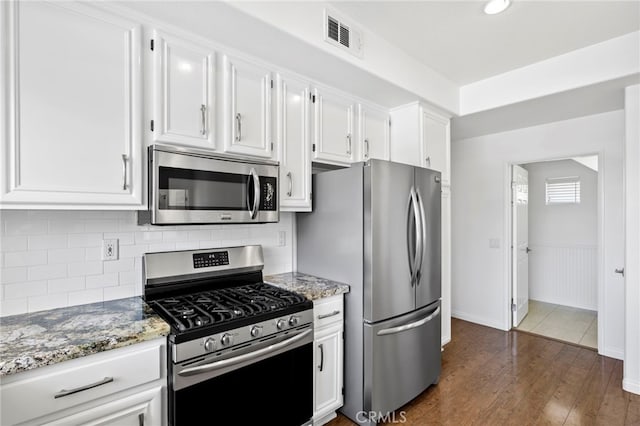 27884 Via De Costa, San Juan Capistrano, CA 92675 - kitchen with appliances with stainless steel finishes, dark wood-style floors, white cabinetry, and light stone countertops