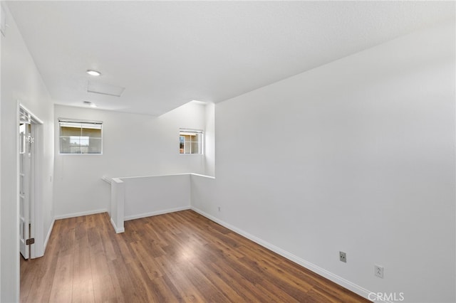 27884 Via De Costa, San Juan Capistrano, CA 92675 - spare room featuring attic access and wood finished floors
