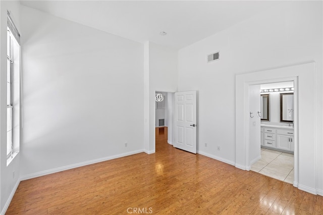 27884 Via De Costa, San Juan Capistrano, CA 92675 - unfurnished bedroom with light wood finished floors and a high ceiling