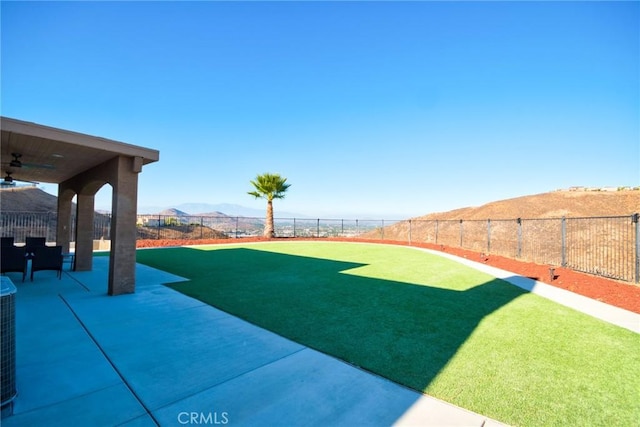 15446 Skyridge Dr, Riverside, CA 92503 - view of yard featuring a ceiling fan, a patio area, and a mountain view