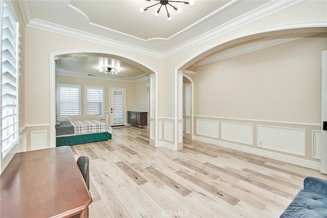 15446 Skyridge Dr, Riverside, CA 92503 - bedroom with arched walkways, a decorative wall, wood finished floors, a chandelier, and crown molding