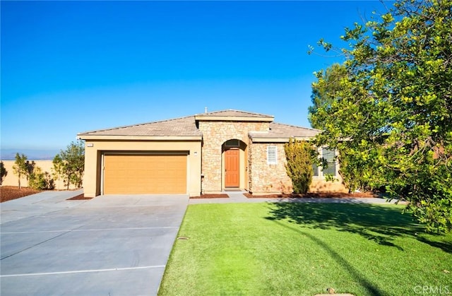 15446 Skyridge Dr, Riverside, CA 92503 - view of front facade featuring stone siding, driveway, an attached garage, a front lawn, and stucco siding