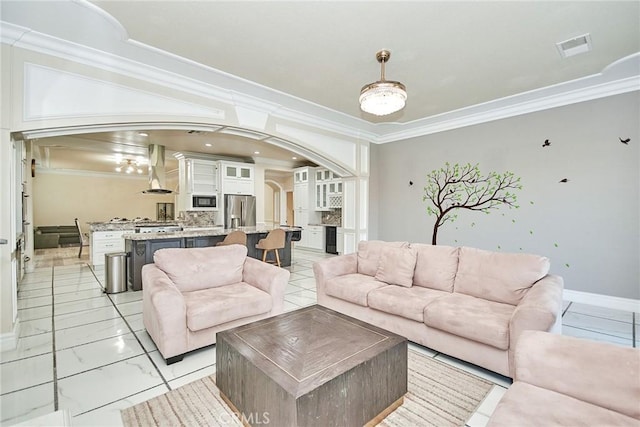 15446 Skyridge Dr, Riverside, CA 92503 - living area featuring arched walkways, ornamental molding, and light marble finish floors