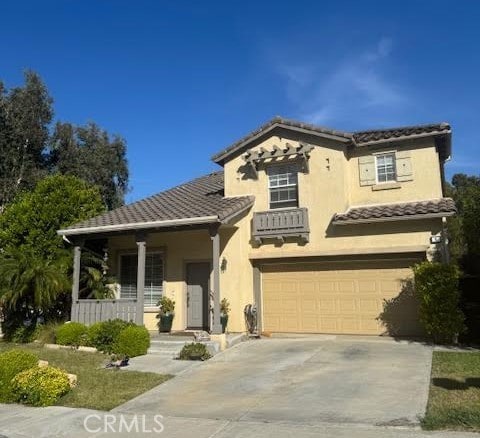 6 Avenida Fortuna, San Clemente, CA 92673 - mediterranean / spanish-style home with a tiled roof, concrete driveway, a garage, stucco siding, and covered porch