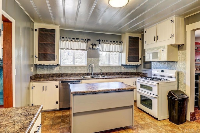 1242 Marshall Rd, Alpine, CA 91901 - kitchen featuring white appliances, tasteful backsplash, dark countertops, and a kitchen island
