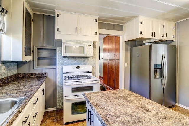 1242 Marshall Rd, Alpine, CA 91901 - kitchen featuring white appliances, white cabinetry, glass insert cabinets, and dark stone finish flooring