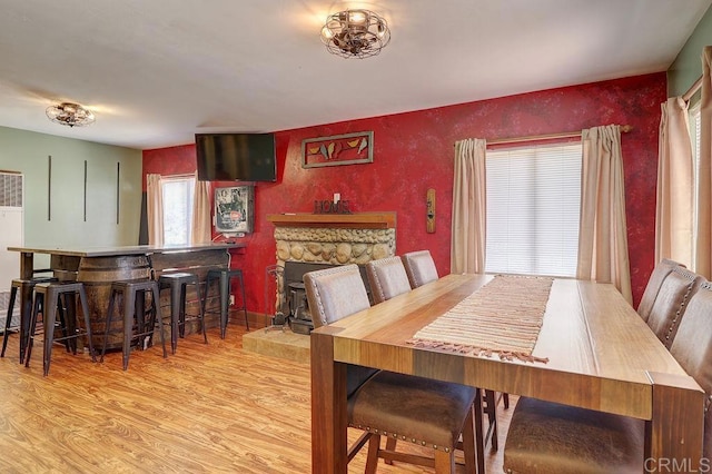 1242 Marshall Rd, Alpine, CA 91901 - dining room featuring wood finished floors, a wood stove, and a heating unit