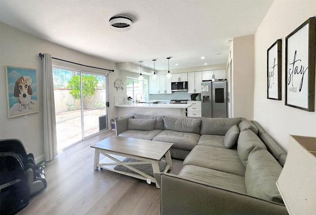 13425 Via Almeria, Tustin, CA 92782 - living room featuring light wood-style flooring and recessed lighting