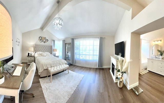 13425 Via Almeria, Tustin, CA 92782 - bedroom featuring wood finished floors, a chandelier, and a fireplace
