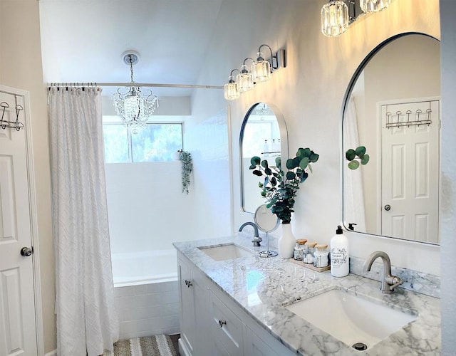 13425 Via Almeria, Tustin, CA 92782 - bathroom featuring a chandelier, double vanity, and tiled shower / bath combo