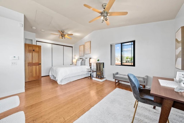 7439 Carrie Ridge Way, San Diego, CA 92139 - bedroom with wood finished floors, vaulted ceiling, a closet, ceiling fan, and a desk
