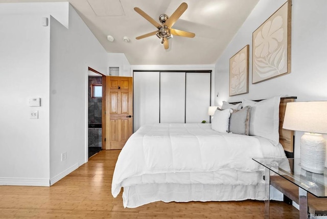 7439 Carrie Ridge Way, San Diego, CA 92139 - bedroom with a closet, light wood-type flooring, lofted ceiling, and ceiling fan