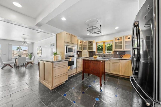 7439 Carrie Ridge Way, San Diego, CA 92139 - kitchen featuring appliances with stainless steel finishes, light brown cabinetry, tasteful backsplash, glass insert cabinets, and recessed lighting