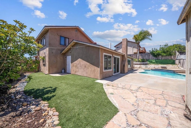 7439 Carrie Ridge Way, San Diego, CA 92139 - back of property with a fenced backyard, a patio, and stucco siding