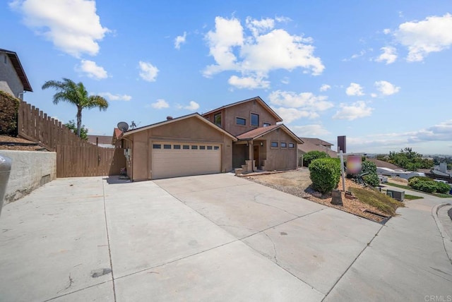 7439 Carrie Ridge Way, San Diego, CA 92139 - view of front facade featuring a garage, driveway, and stucco siding