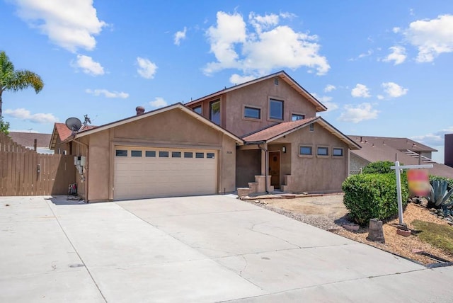 7439 Carrie Ridge Way, San Diego, CA 92139 - view of front of house with stucco siding, driveway, and an attached garage