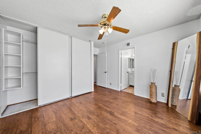 7439 Carrie Ridge Way, San Diego, CA 92139 - unfurnished bedroom featuring wood finished floors, a textured ceiling, ceiling fan, and ensuite bathroom