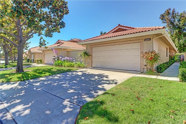 1255 S Upland Hills Dr S, Upland, CA 91786 - view of front of house with stucco siding, a tiled roof, and an attached garage