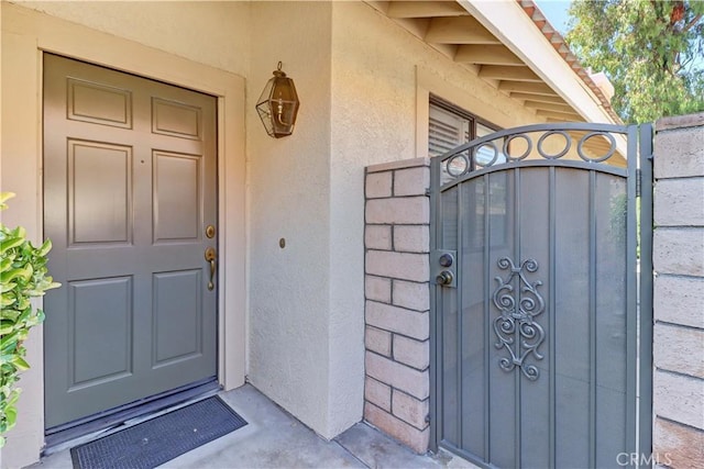 1255 S Upland Hills Dr S, Upland, CA 91786 - entrance to property with a gate and stucco siding