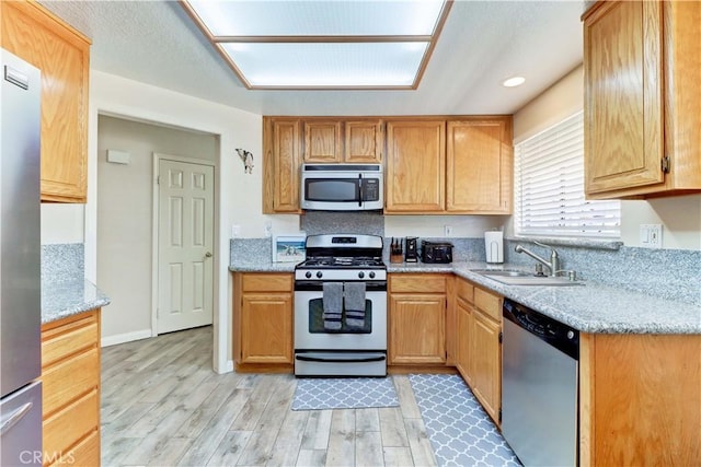 1255 S Upland Hills Dr S, Upland, CA 91786 - kitchen featuring stainless steel appliances, light wood-style flooring, light stone countertops, and recessed lighting