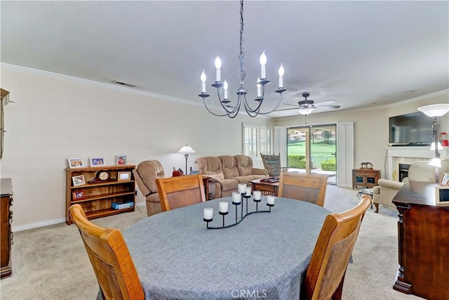 1255 S Upland Hills Dr S, Upland, CA 91786 - dining area featuring light carpet, ornamental molding, a ceiling fan, a tiled fireplace, and a chandelier