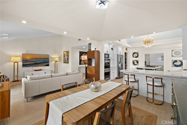 2719 Vista Umbrosa, Newport Beach, CA 92660 - dining room featuring vaulted ceiling, recessed lighting, a chandelier, and light wood finished floors