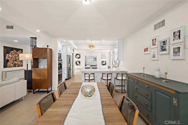 2719 Vista Umbrosa, Newport Beach, CA 92660 - dining space featuring light wood-style floors, recessed lighting, a chandelier, and a tray ceiling