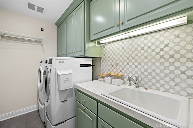 2719 Vista Umbrosa, Newport Beach, CA 92660 - washroom featuring cabinet space, washing machine and clothes dryer, and dark tile patterned floors