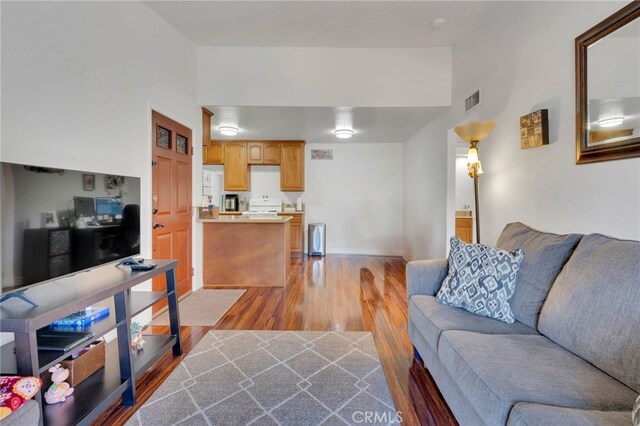 2500 San Gabriel Way Unit 306, Corona, CA 92882 - living room with light wood finished floors and baseboards