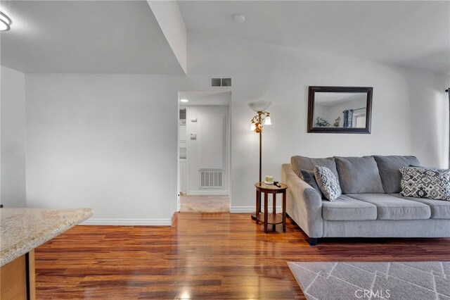 2500 San Gabriel Way Unit 306, Corona, CA 92882 - living room with wood finished floors and lofted ceiling