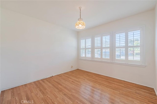 2605 Robinson St, Redondo Beach, CA 90278 - empty room featuring healthy amount of natural light, light wood-type flooring, and a chandelier
