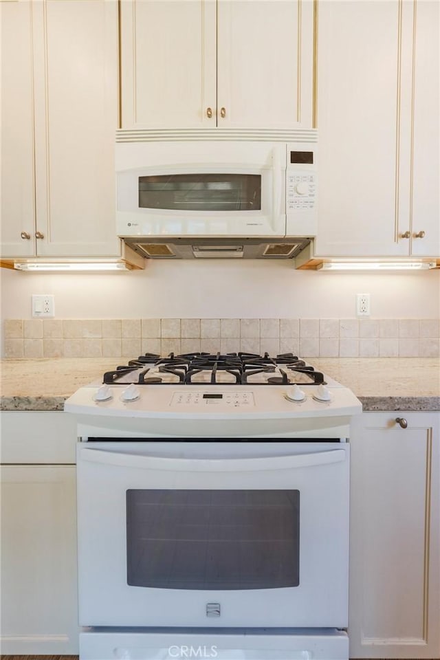 2605 Robinson St, Redondo Beach, CA 90278 - kitchen with white appliances, white cabinets, and light stone countertops