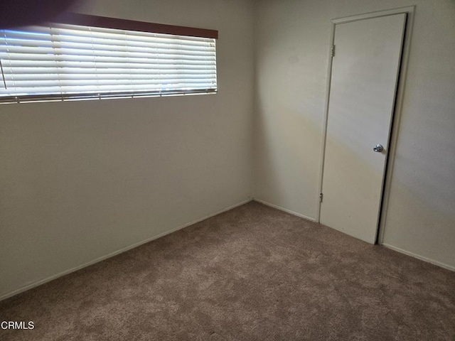 45409 Rodin Ave, Lancaster, CA 93535 - carpeted empty room with baseboards