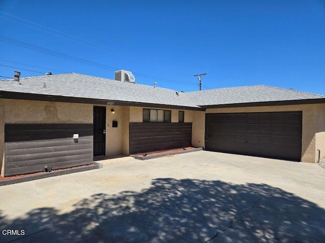 45409 Rodin Ave, Lancaster, CA 93535 - ranch-style home with an attached garage, stucco siding, and concrete driveway
