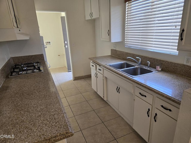 45409 Rodin Ave, Lancaster, CA 93535 - kitchen featuring under cabinet range hood, gas stovetop, white cabinetry, and light tile patterned flooring