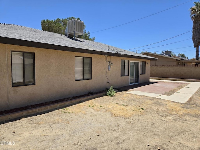 45409 Rodin Ave, Lancaster, CA 93535 - back of house with a patio area, a shingled roof, and stucco siding