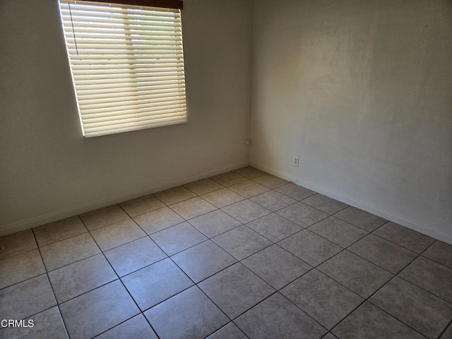 45409 Rodin Ave, Lancaster, CA 93535 - tiled empty room with baseboards
