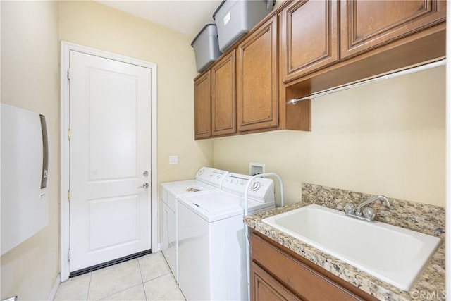 60284 Honeysuckle St, La Quinta, CA 92253 - laundry area with washing machine and dryer, cabinet space, and light tile patterned floors