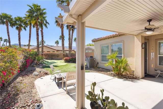 60284 Honeysuckle St, La Quinta, CA 92253 - fenced backyard with a patio and ceiling fan