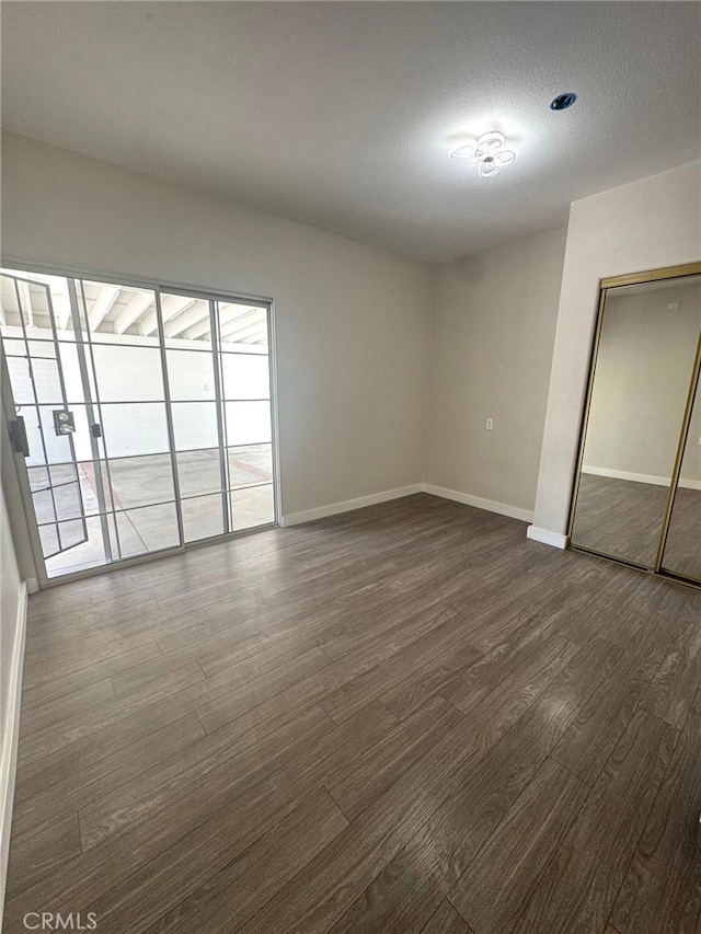 7892 8th St, Buena Park, CA 90621 - spare room with dark wood finished floors and baseboards