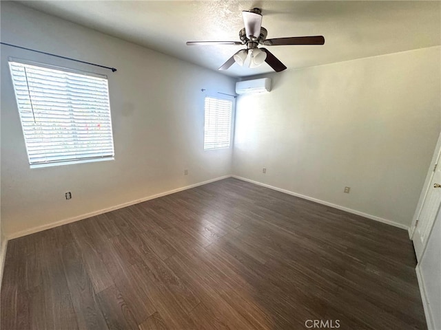 7892 8th St, Buena Park, CA 90621 - unfurnished room with an AC wall unit, ceiling fan, and dark wood finished floors