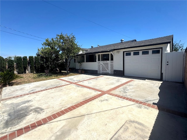 7892 8th St, Buena Park, CA 90621 - single story home with concrete driveway, an attached garage, and stucco siding