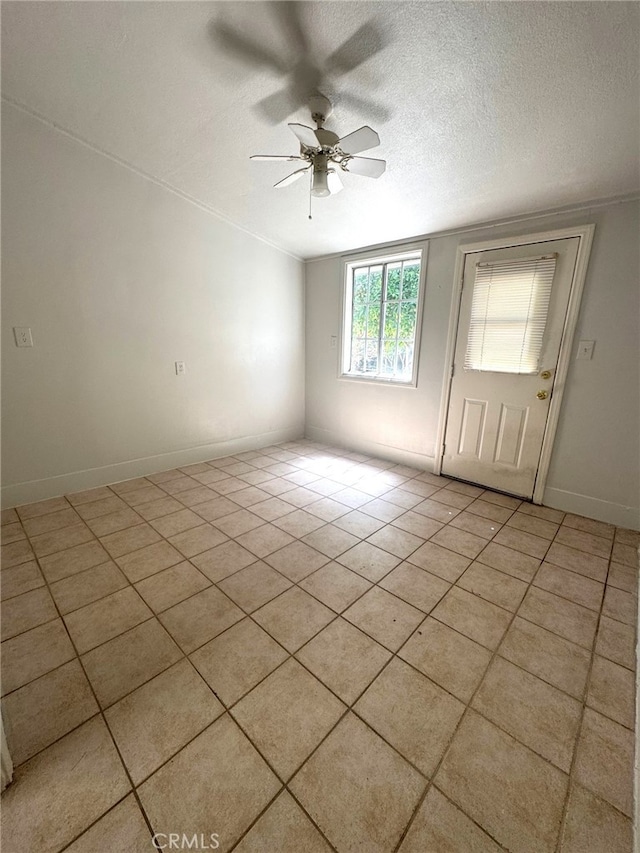 7892 8th St, Buena Park, CA 90621 - empty room featuring a ceiling fan, light tile patterned floors, and a textured ceiling