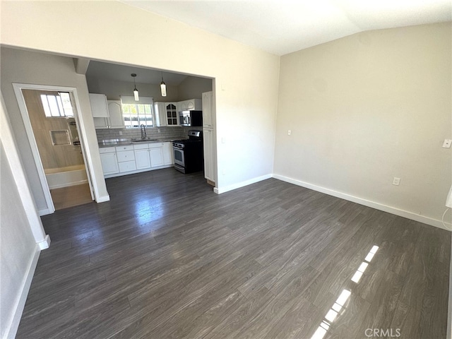 7892 8th St, Buena Park, CA 90621 - unfurnished living room with dark wood-type flooring and vaulted ceiling
